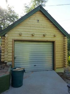 Log garage to match log sided house