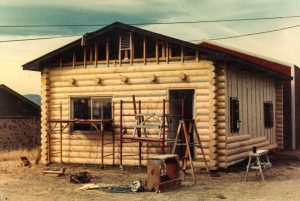 Remodel with log siding and Timberline log corners on commercial building in Hygiene, CO