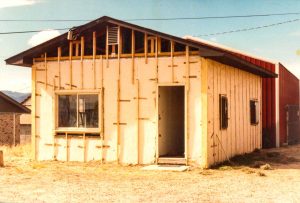 Remodel with log siding and Timberline log corners on commercial building in Hygiene, CO