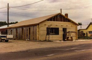 Remodel with log siding and Timberline log corners on commercial building in Hygiene, CO