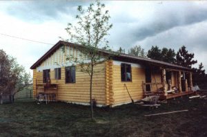 Remodel with log siding and Timberline log corners on house with lap siding.