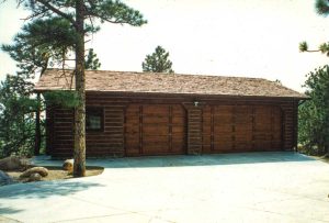 Remodel with log siding and Timberline log corners on a garage to match the owners log house.