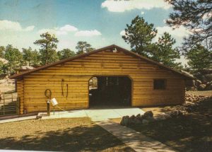 Remodel with log siding and Timberline log corners on horse barn.