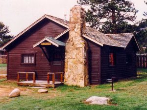 Estes park cabin before remodel. Brown clap board siding.