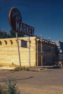 Remodel with log siding and Timberline log corners on old grocery store in Loveland CO