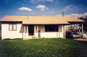 Remodel with log siding and Timberline log corners on house with lap siding. Log porch