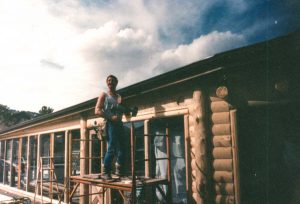 Remodel with log siding and Timberline log corners on a earth-home.