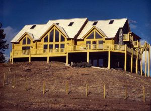 Log sided home on a hill