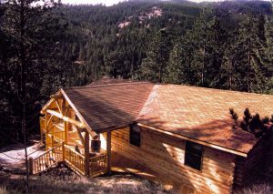 Remodel with log siding and Timberline log corners in the mountains above Glenhaven CO